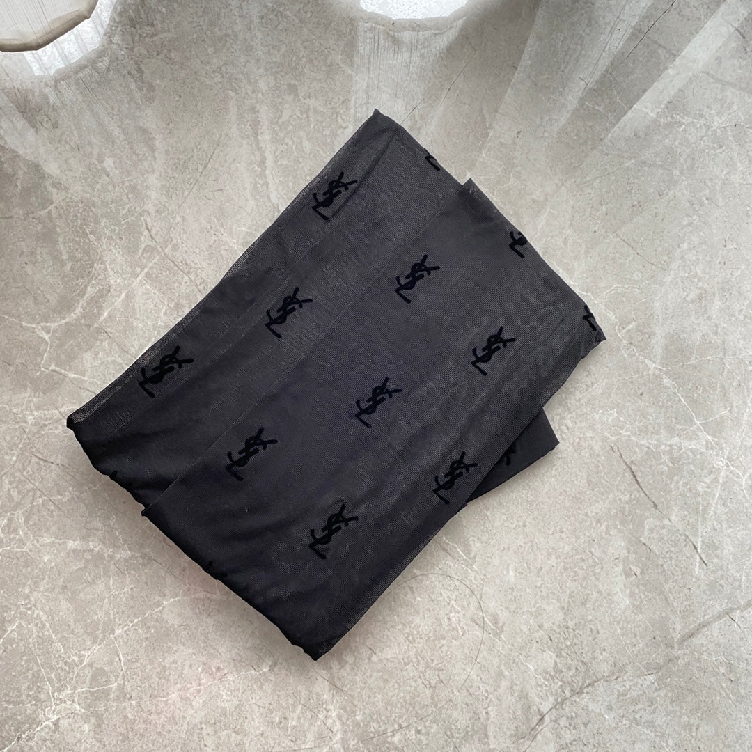 YSL flocked logo haute couture black pantyhose