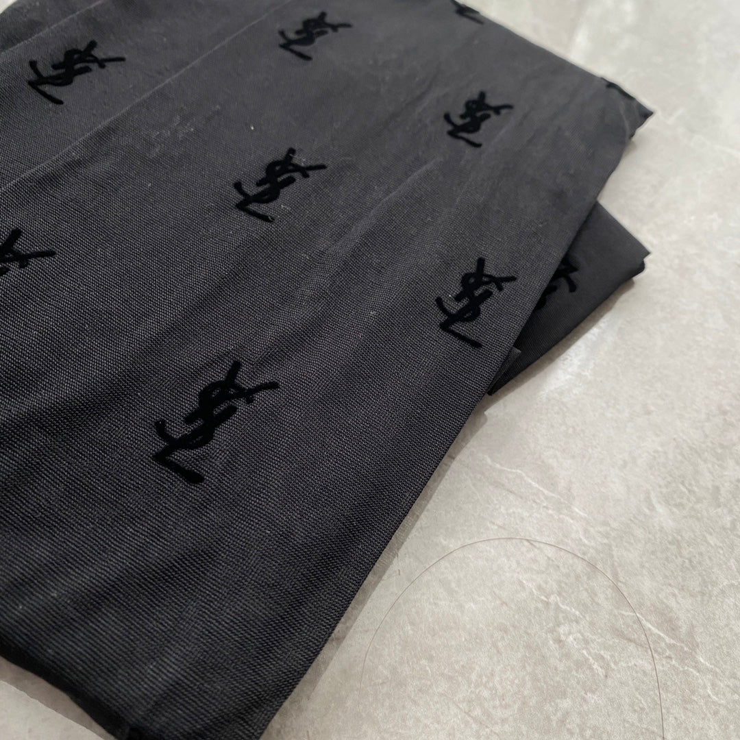 YSL flocked logo haute couture black pantyhose