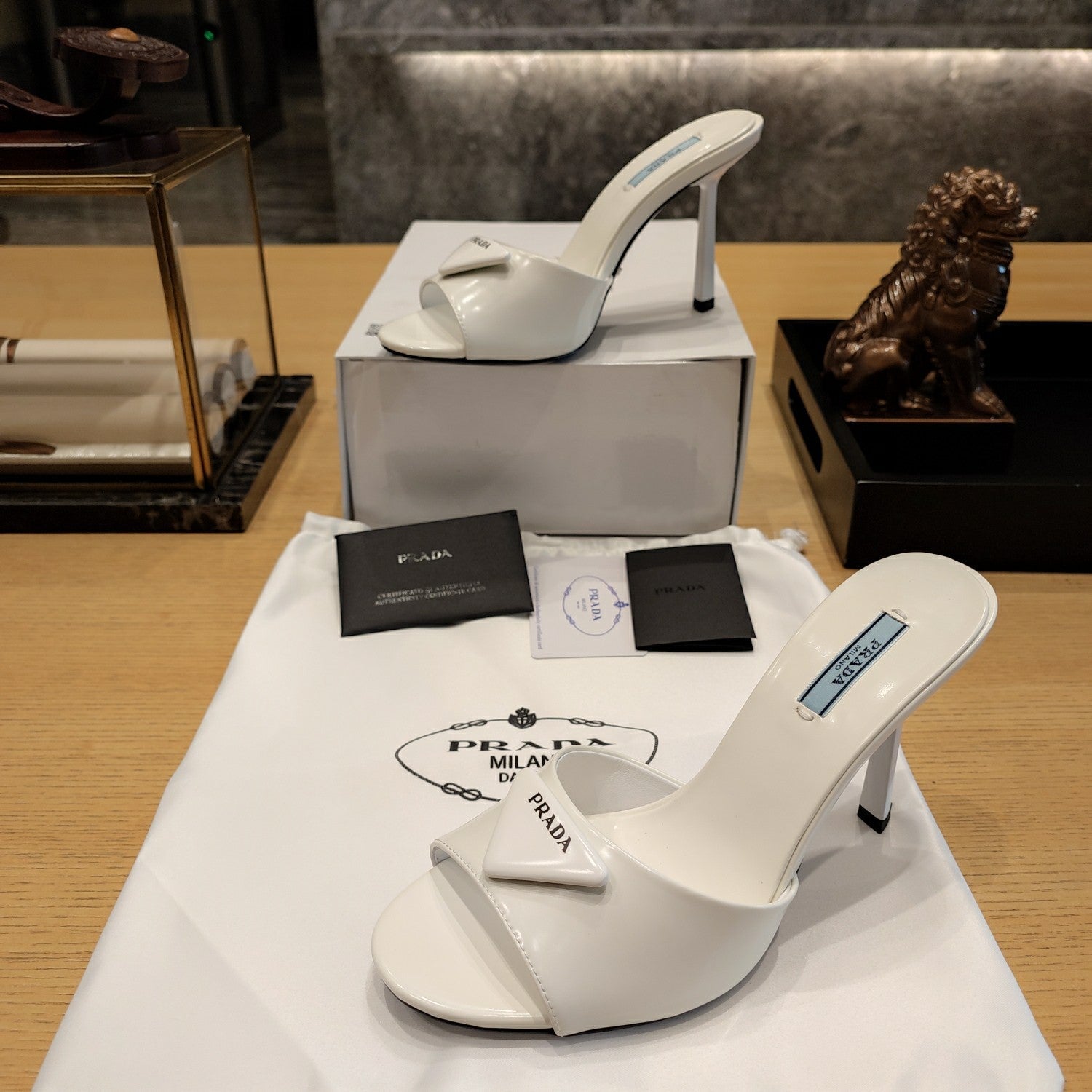 Prad 26s Open Toe Mules 100mm In Ivory White Patent Calfskin With Logo