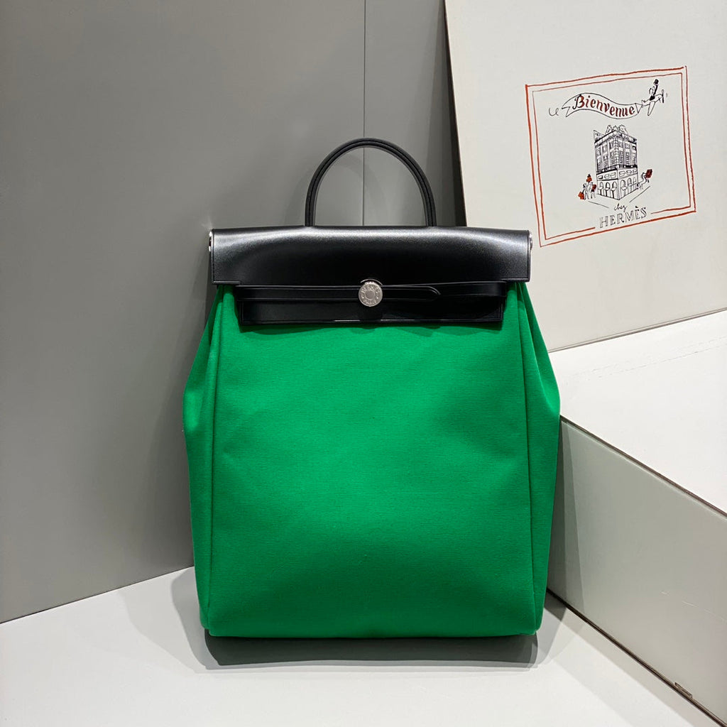 HERMES HERBAG A DOS ZIP RETOURNE BACKPACK 29 IN GREEN CANVAS AND BLACK CALFSKIN