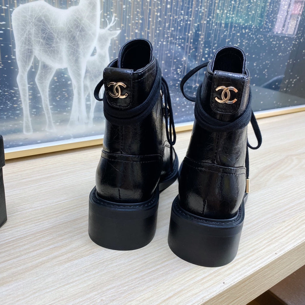 CHANEL COMBAT BOOTS IN BLACK WRINKLED CALFSKIN AND GROSGRAIN WITH FAUX PEARL